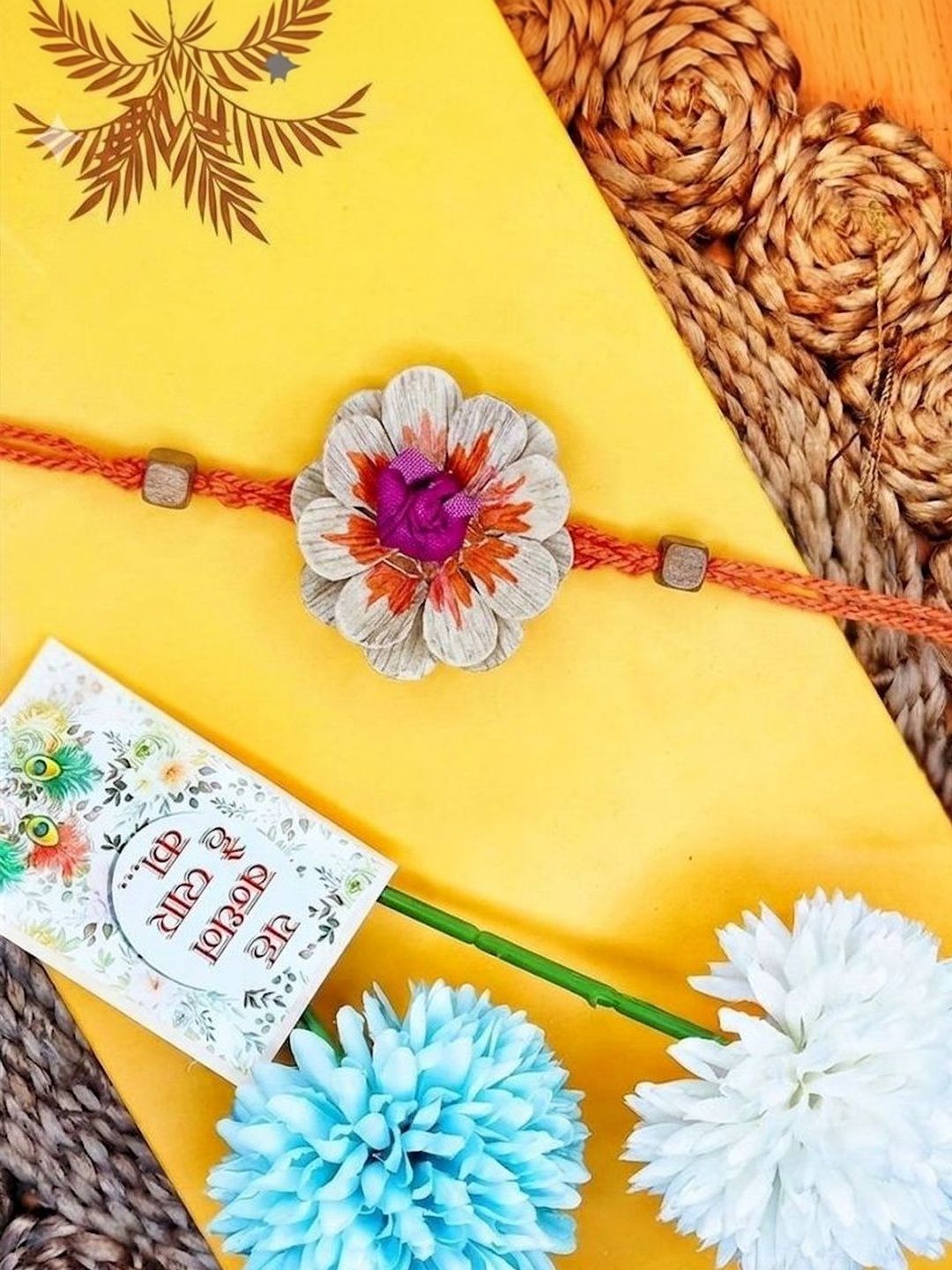 Dhiyona Multicolor Floral Design Plant Seed Rakhi With Roli Chawal Chandan Mishri