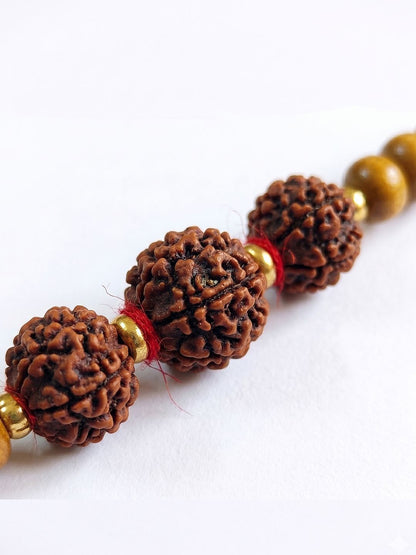 Dhiyona Religious Rudraksh & Red Thread Rakhi With Roli Chawal Chandan Mishri