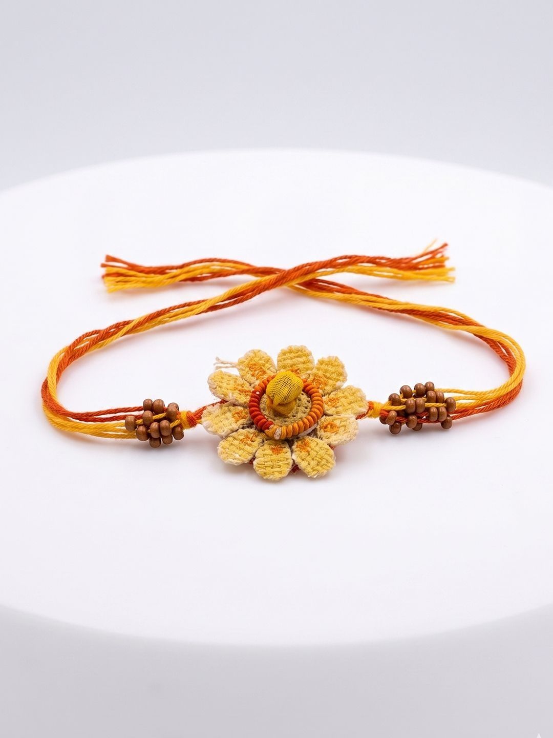 Dhiyona Yellow Floral Seed Thread Rakhi With Roli Chawal Chandan Mishri