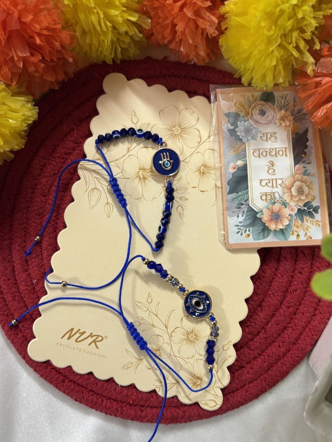 Dhiyona Set Of 2 Blue Evil Eye Thread Rakhi With Roli Chawal Chandan Mishri
