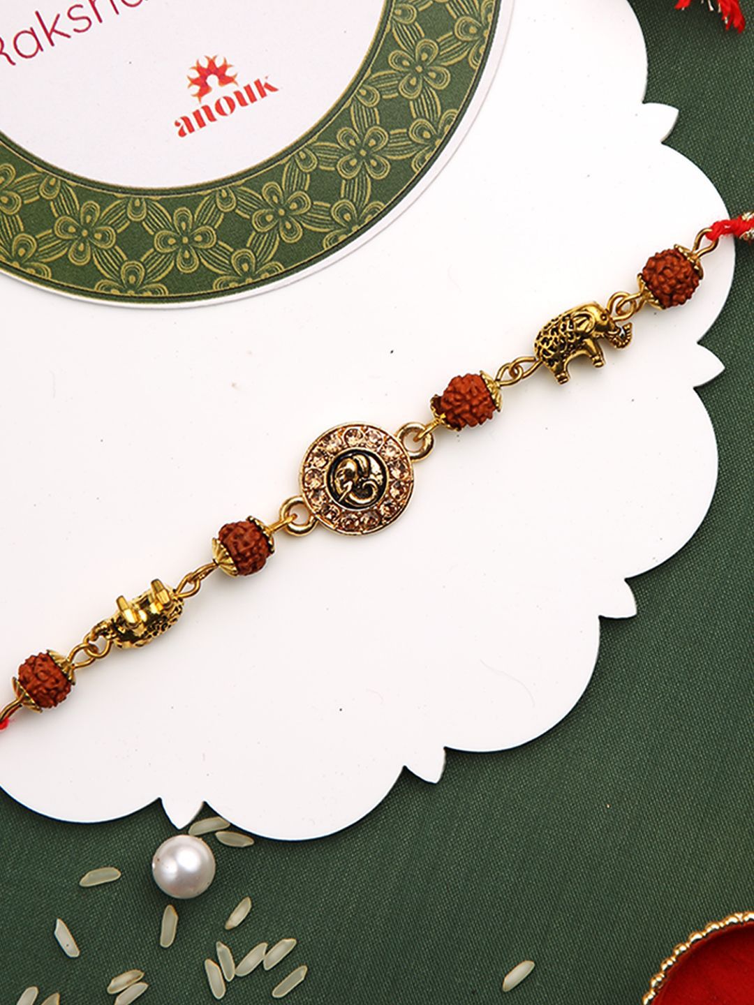 Dhiyona Stones Studded & Rudhraksh Beaded Rakhi With Roli Chawal & Greeting Card
