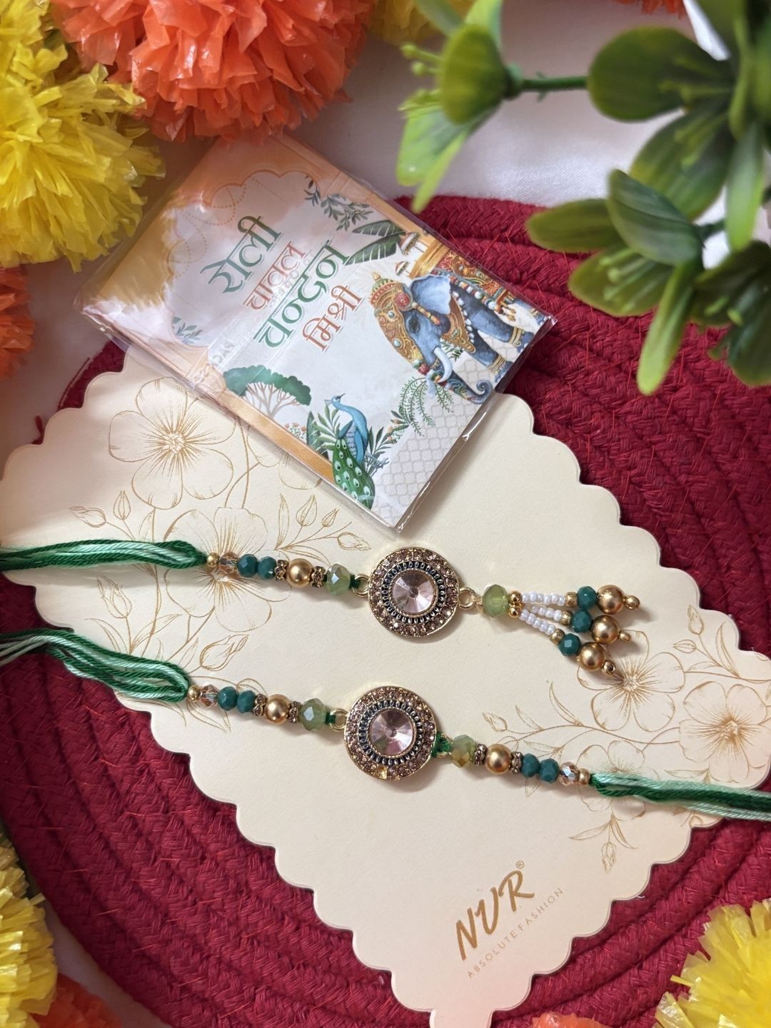 Dhiyona Set Of 2 Ad Drawstring Bhaiya Bhabhi Rakhi With Roli Chawal Chandan Mishri