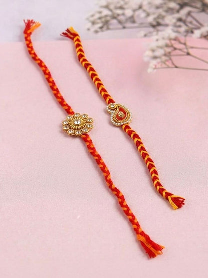 Dhiyona Set Of 2 Gold & Red Thread & Kundan Rakhi With Roli Chawal Chandan Mishri