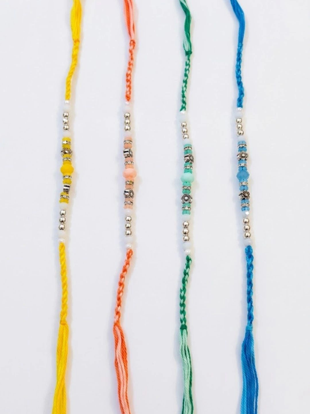 Dhiyona Set Of 4 Multicolor Artificial Beads Thread Rakhi With Roli Chawal Chandan Mishri