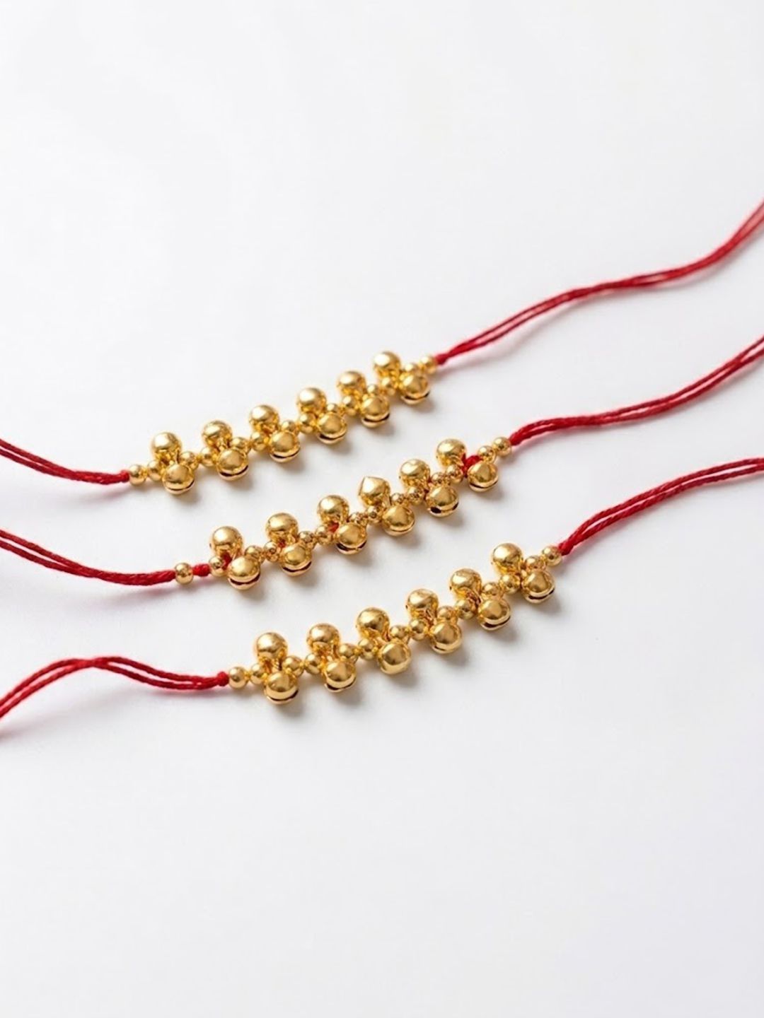 Dhiyona Set Of 3 Gold Toned Ghungroo & Red Thread Rakhi With Roli Chawal Chandan Mishri