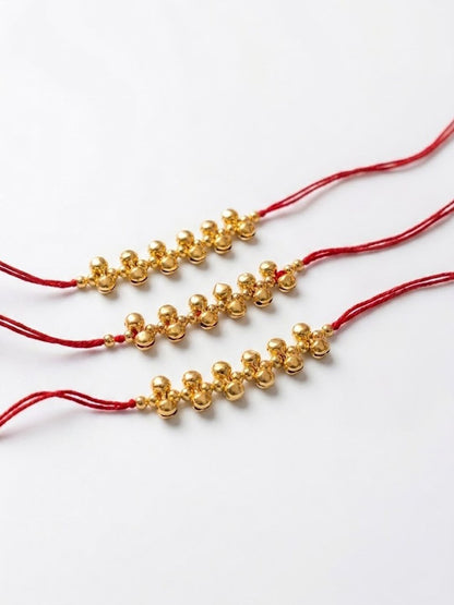 Dhiyona Set Of 3 Gold Toned Ghungroo & Red Thread Rakhi With Roli Chawal Chandan Mishri