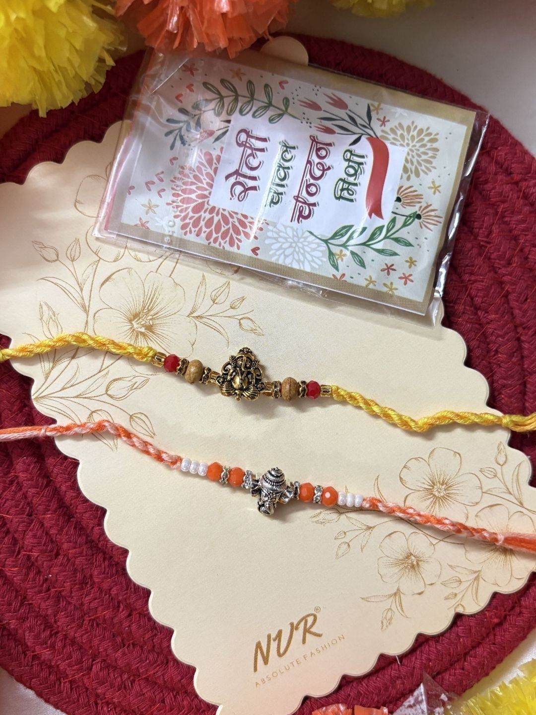 Dhiyona Set Of 2 Multicolor Religious Thread Rakhi With Roli Chawal Chandan Mishri