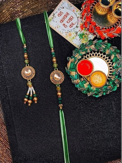 Dhiyona Set Of 2 Ad Drawstring Bhaiya Bhabhi Rakhi With Roli Chawal Chandan Mishri