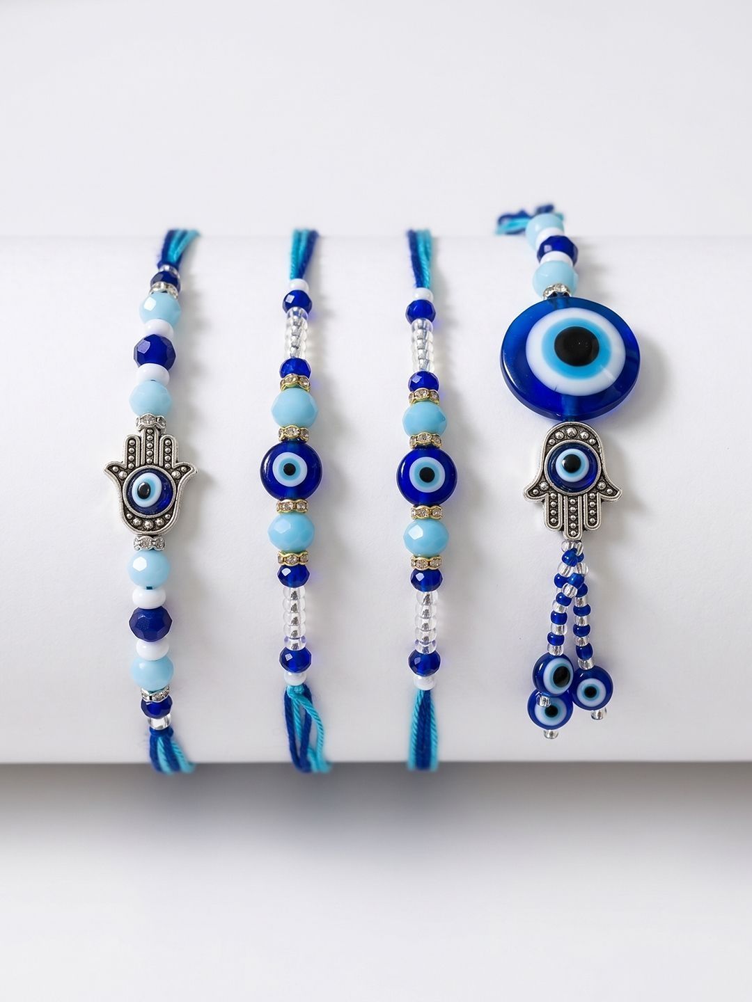 Dhiyona Set Of 4 Designer Blue Evil Eye Thread Rakhi With Roli Chawal Chandan Mishri