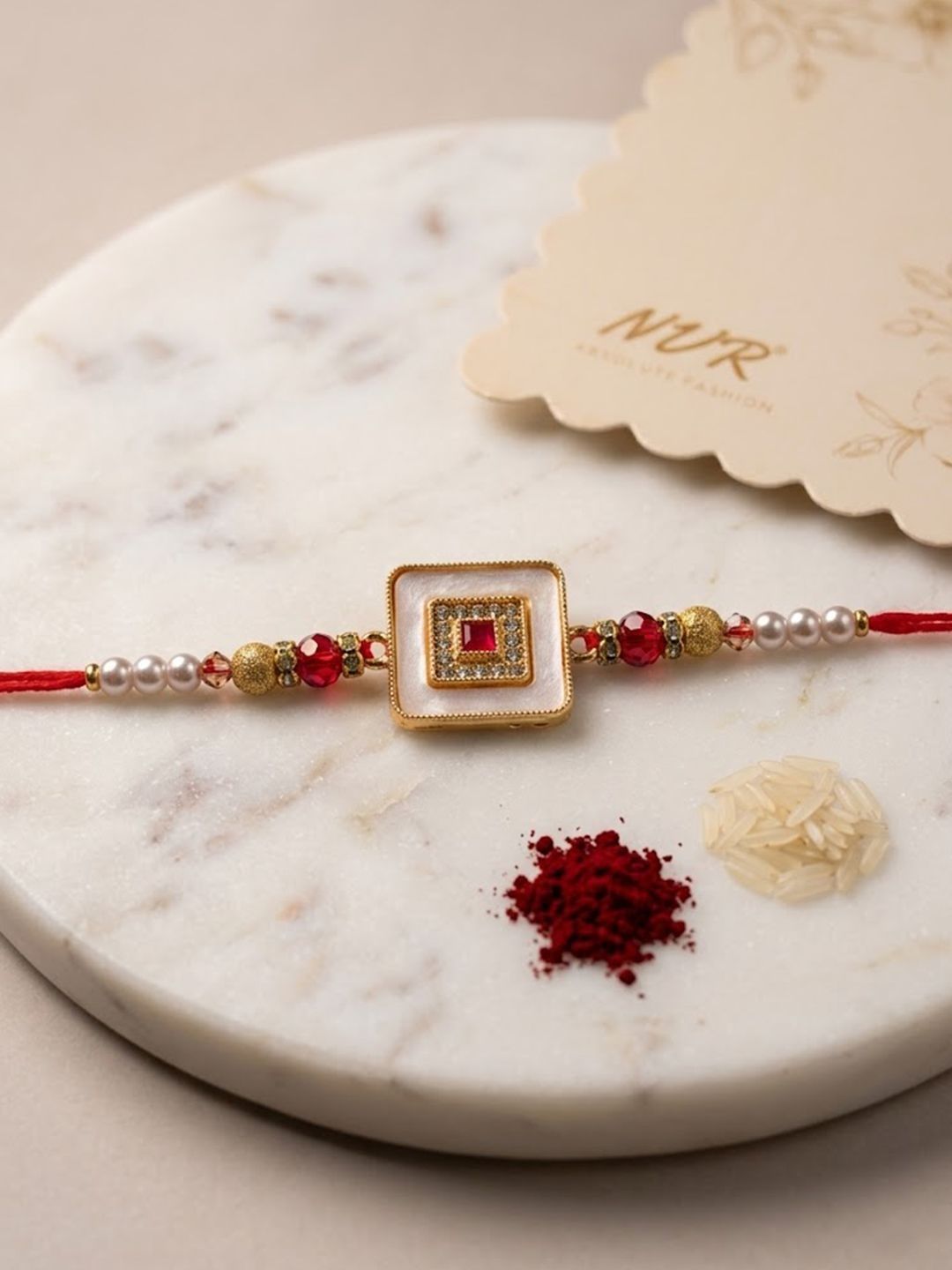 Dhiyona Square Design Multicolor Artificial Stones & Pearls Thread Rakhi With Roli Chawal