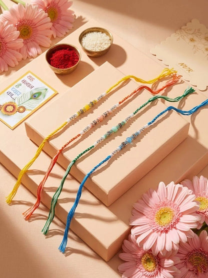 Dhiyona Set Of 4 Multicolor Artificial Beads Thread Rakhi With Roli Chawal Chandan Mishri