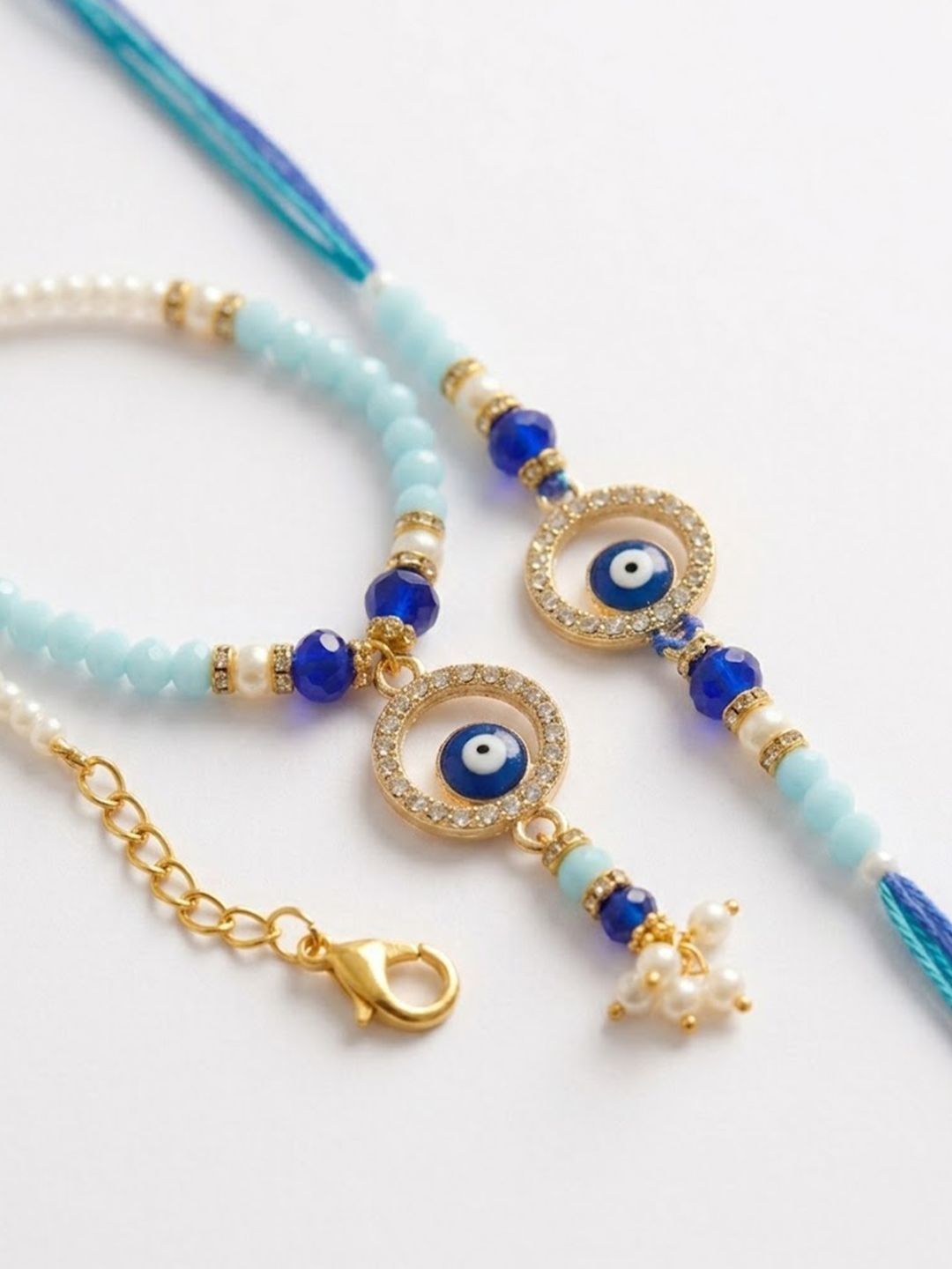 Dhiyona Set Of 2 Blue Evil Eye Gold Toned Beaded Bhaiya Bhabhi Rakhi