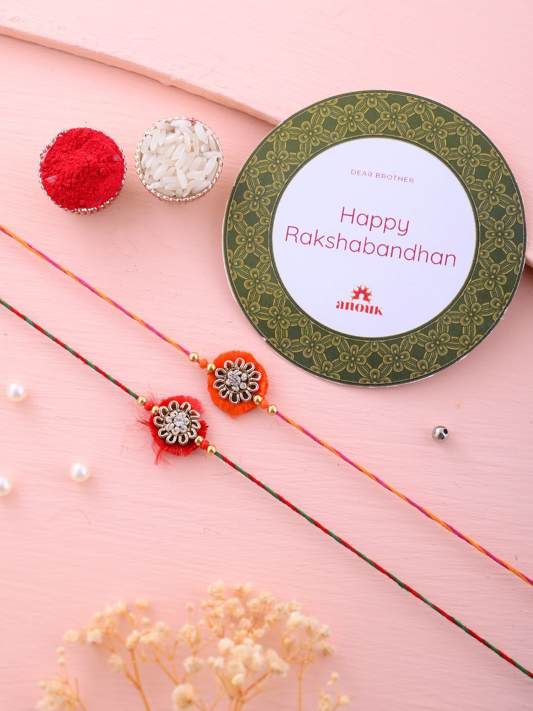Dhiyona Set Of 2 Red Flower Design Stone Studded Rakhis Comes With Roli Rice & Greeting Card