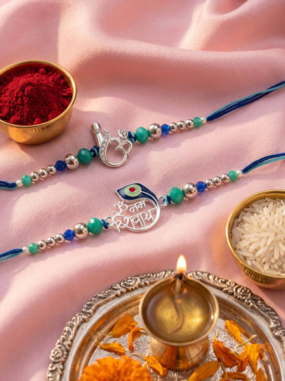 Dhiyona Set Of 2 Silver Toned Beaded Religious Thread Rakhi With Roli Chawal Chandan Mishri