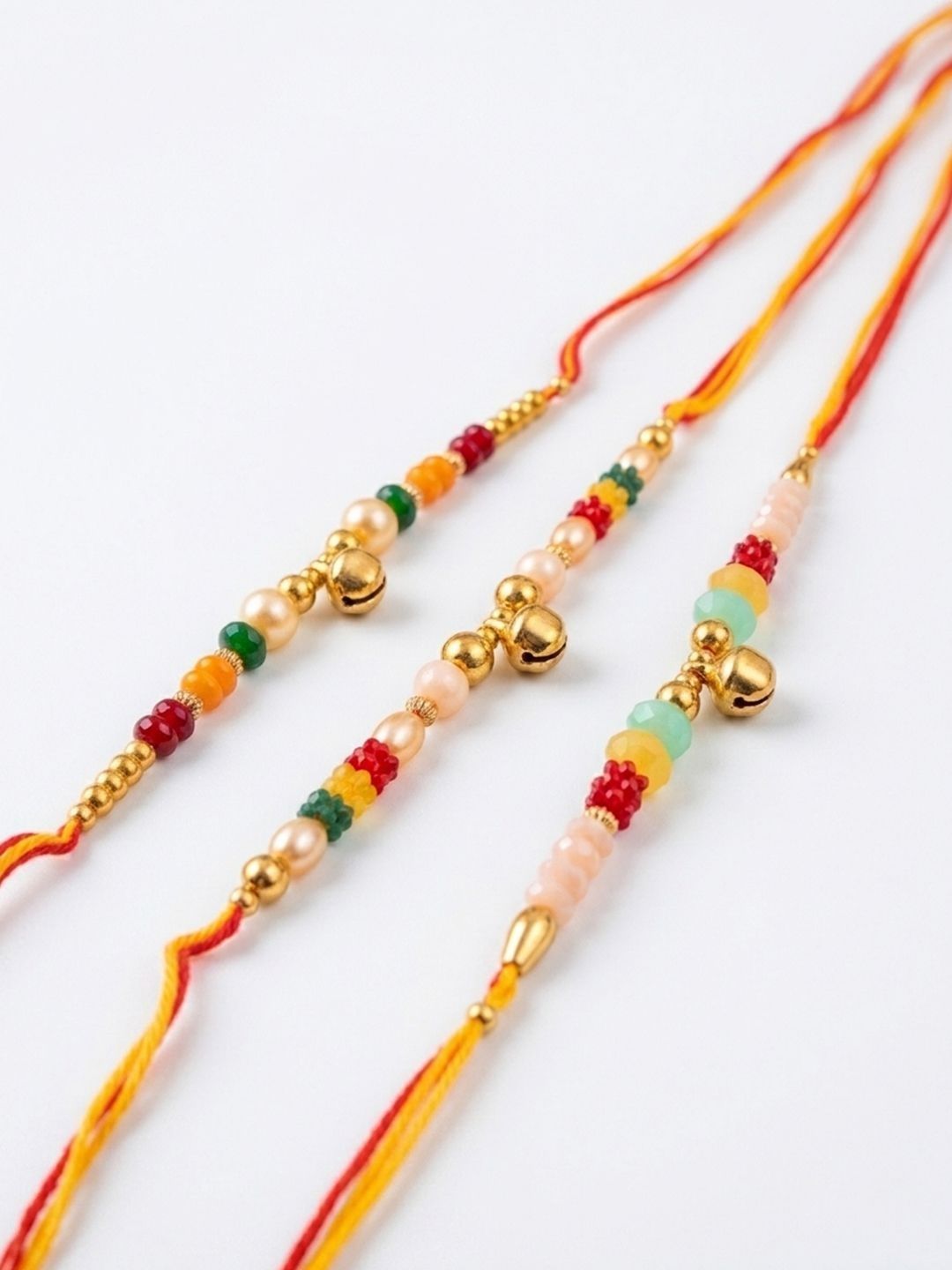 Dhiyona Set Of 3 Artificial Beads Orange Thread Rakhi With Roli Chawal Chandan Mishri