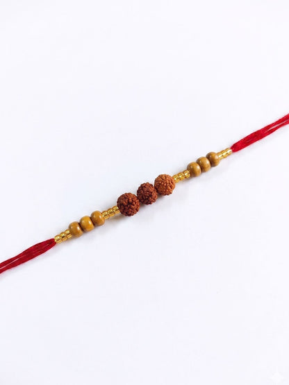 Dhiyona Religious Rudraksh & Red Thread Rakhi With Roli Chawal Chandan Mishri