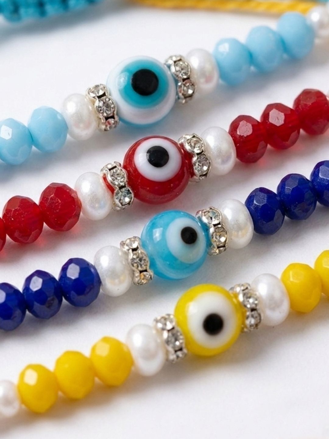 Anouk Set Of 4 Multicolor Evil Eye Thread Rakhi With Roli Chawal Chandan Mishri