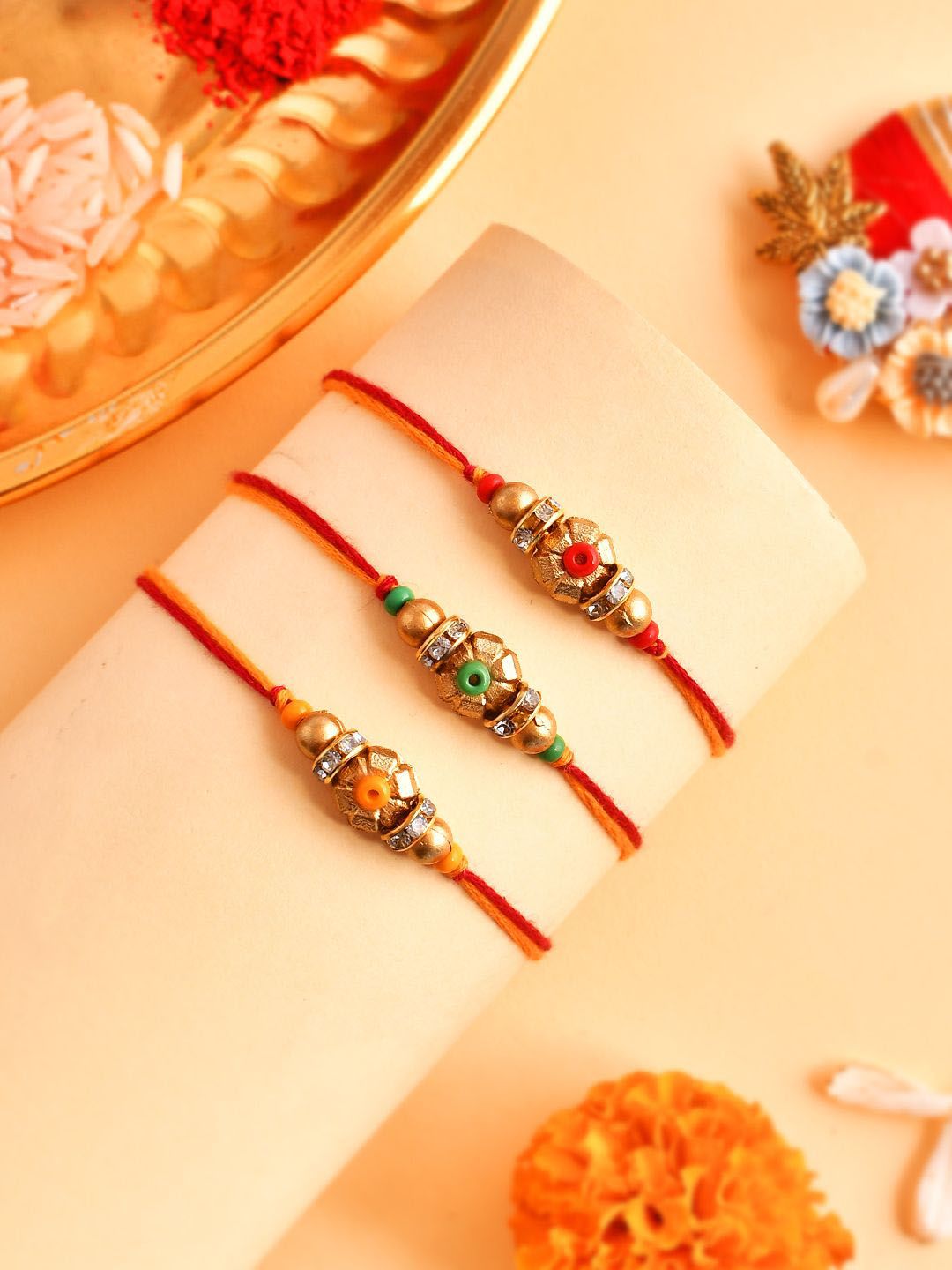 Dhiyona Set Of 3 Gold-Toned Beaded Rakhi With Roli Rice & Greeting Card