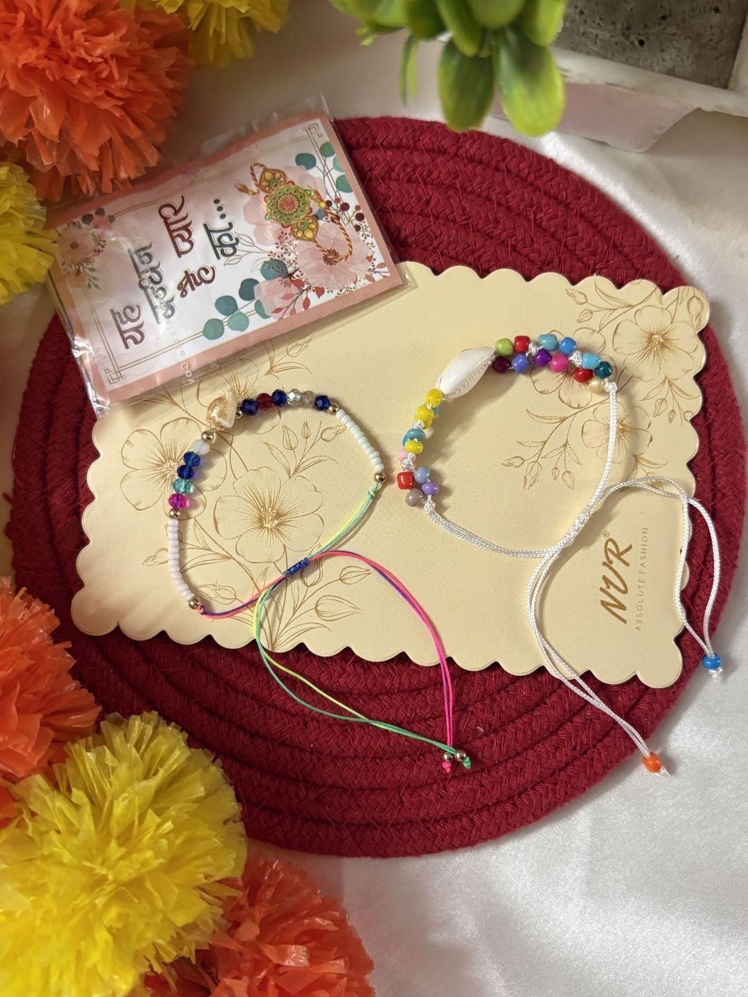Dhiyona Set Of 2 Artificial Beads Thread Rakhi With Roli Chawal Chandan Mishri