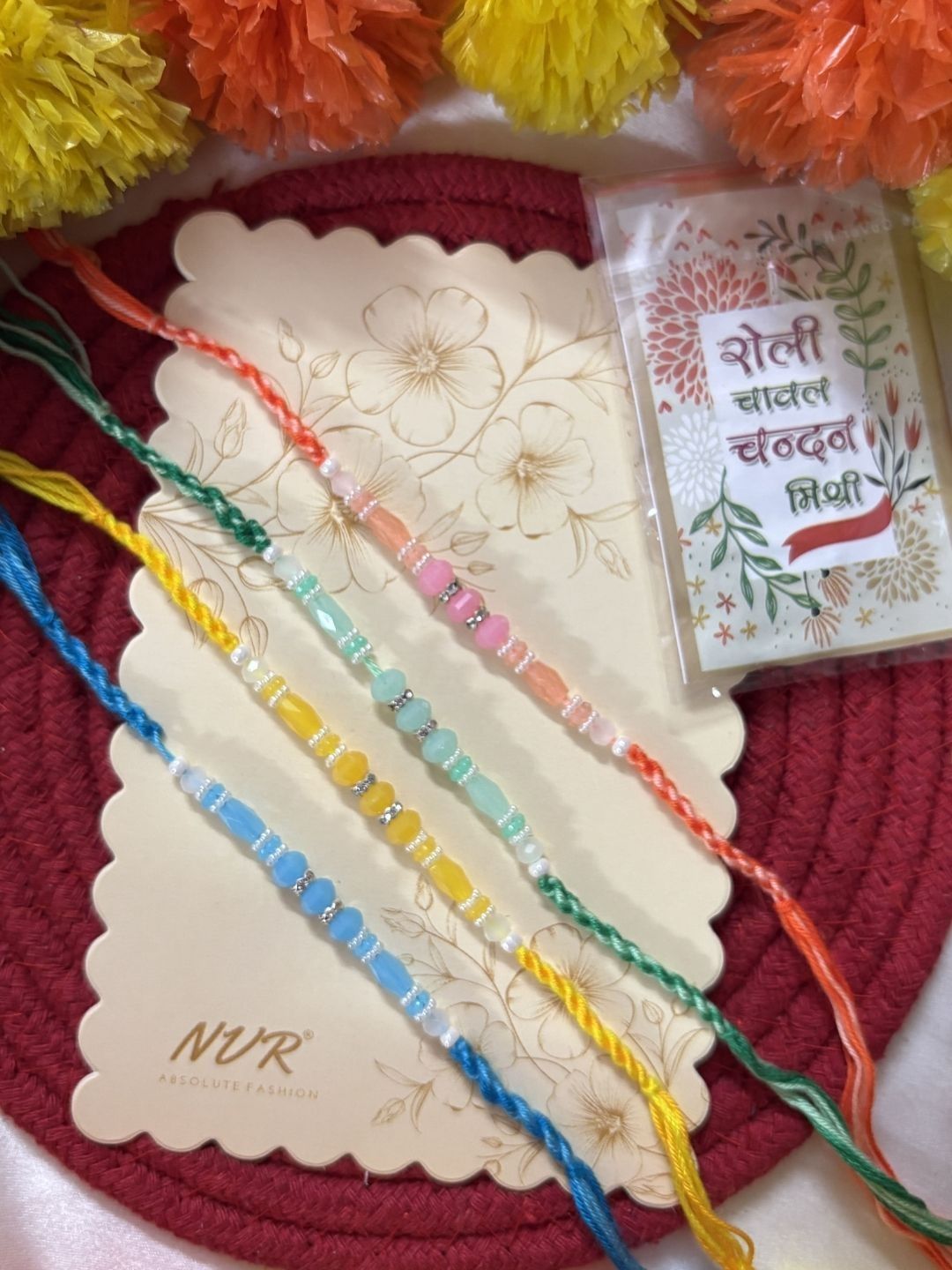 Dhiyona Set Of 4 Multicolor Artificial Beads Thread Rakhi With Roli Chawal Chandan Mishri