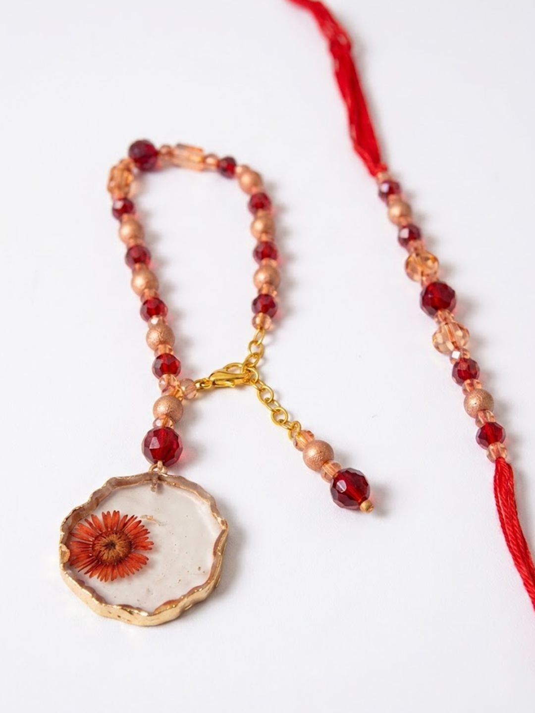 Dhiyona Set Of 2 Gold Toned Red Artificial Beads Bhaiya Bhabhi Rakhi