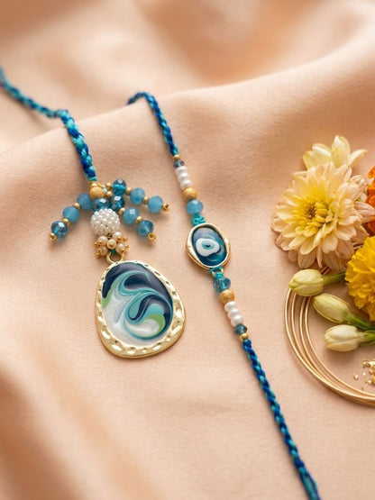 Dhiyona Set Of 2 Blue Evil Eye Traditional Gold Toned Bhaiya Bhabhi Rakhi With Roli Chawal