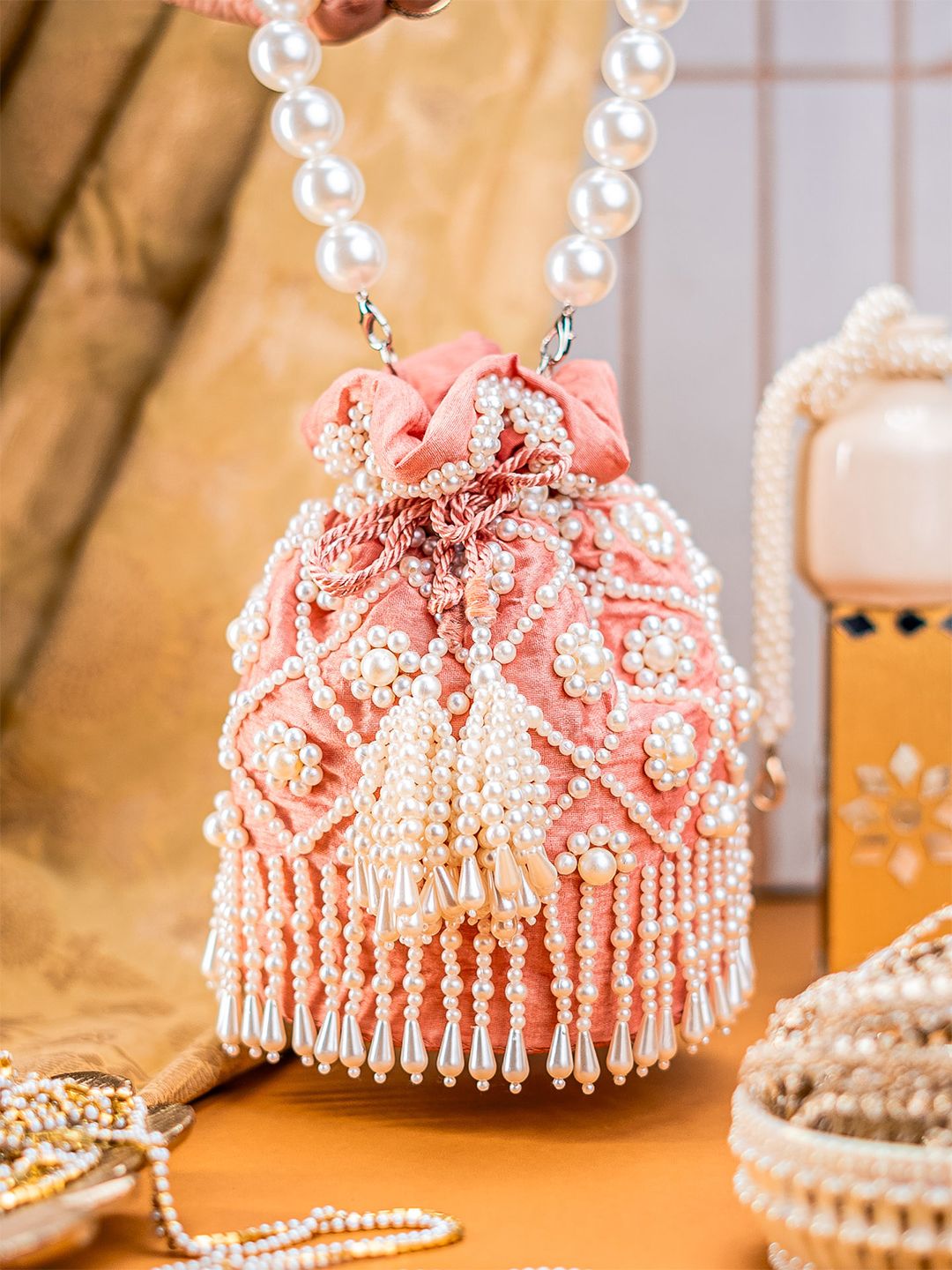Dhiyona NR Pearls Embroidered Embellished Velvet Potli Clutch