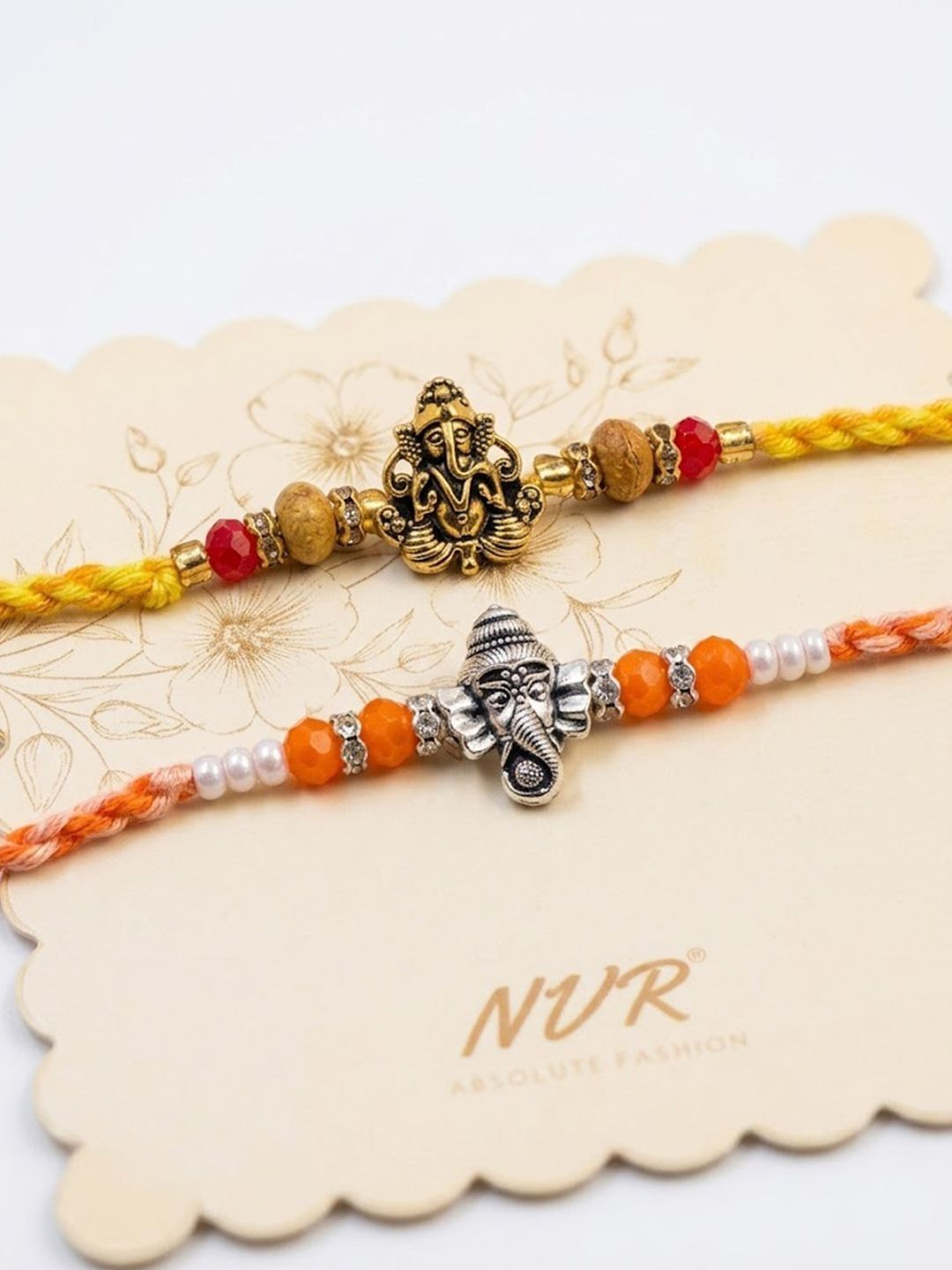 Dhiyona Set Of 2 Multicolor Religious Thread Rakhi With Roli Chawal Chandan Mishri
