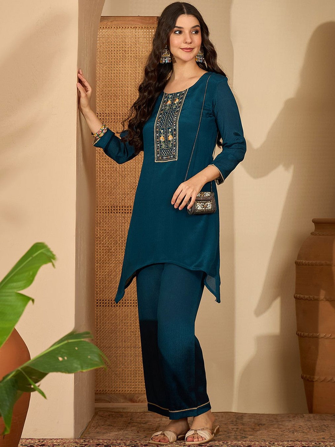 Women Ethnic Motifs Embroidered Asymmetric Sequinned Kurti with Palazzos