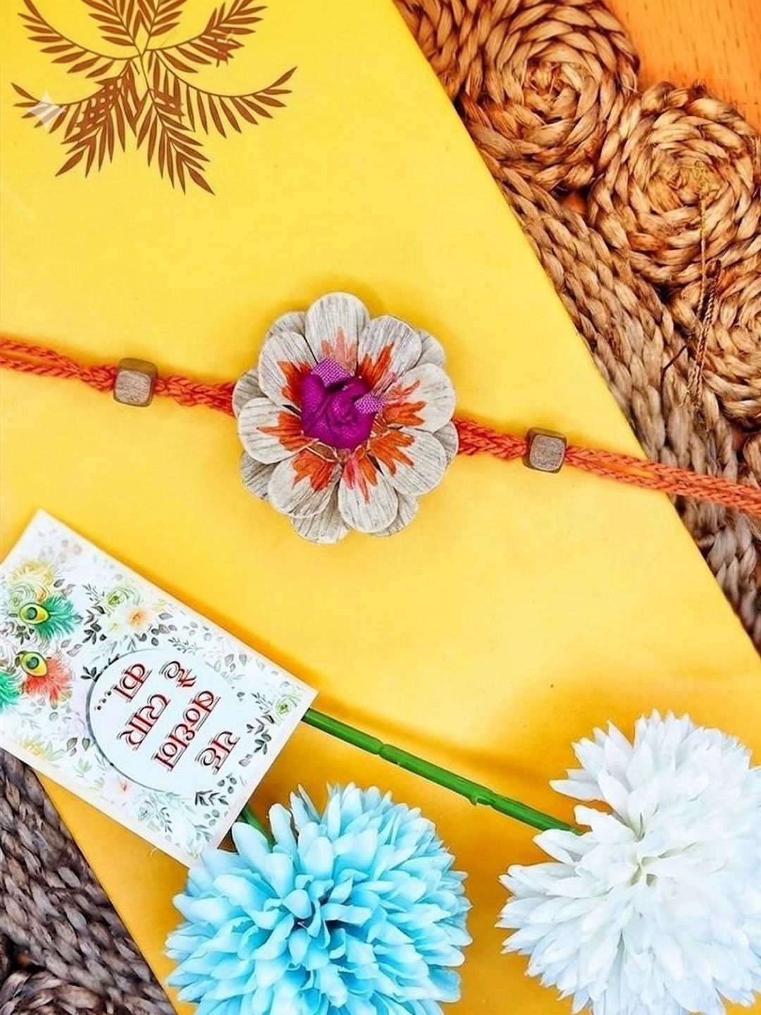 Dhiyona Multicolor Floral Design Plant Seed Rakhi With Roli Chawal Chandan Mishri