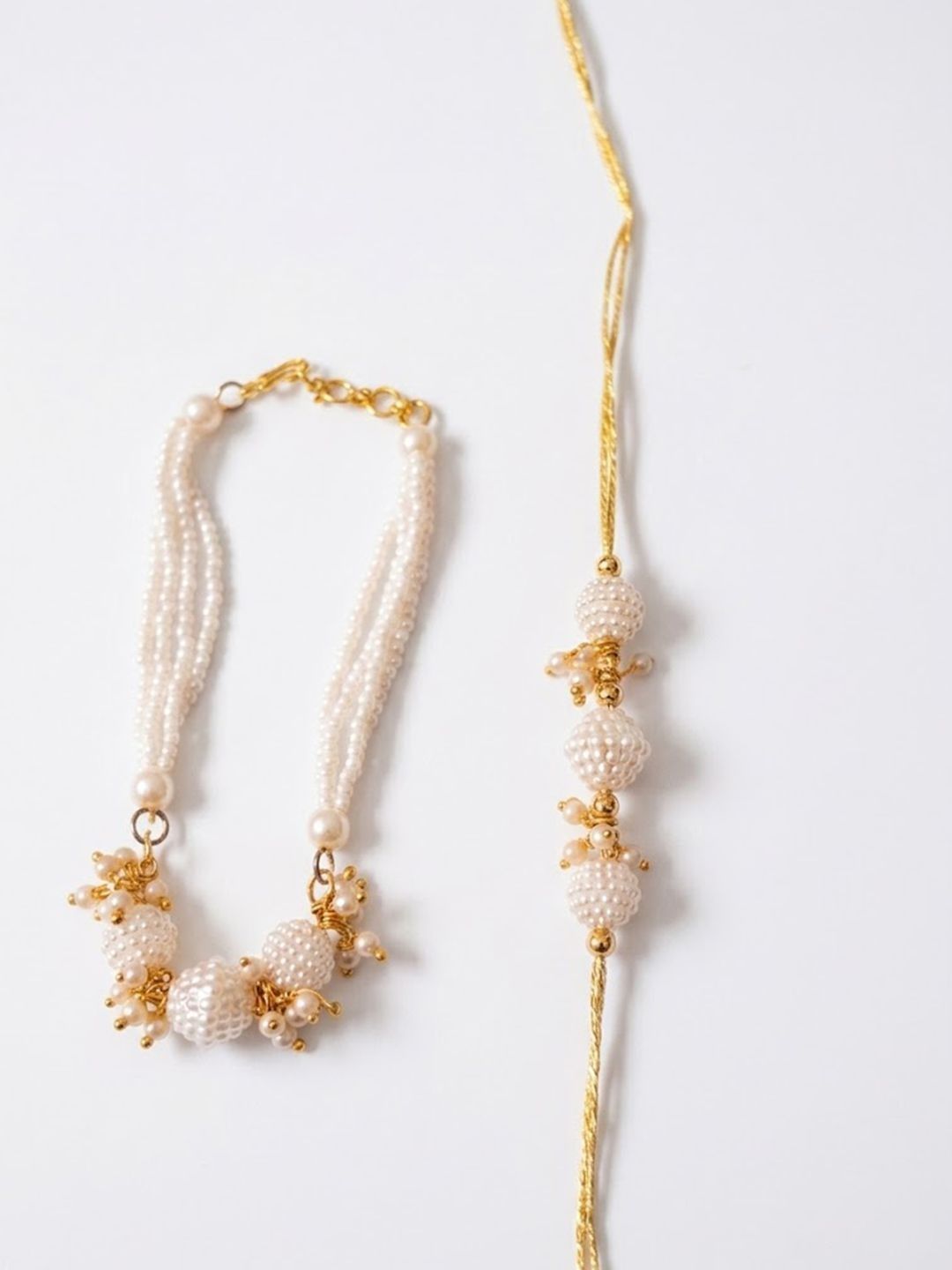 Dhiyona Set Of 2 Gold Toned & White Pearls Bhaiya Bhabhi Rakhi