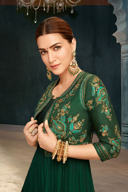 emerald green silk festive tiered anarkali dress Make a statement with this bold and versatile green fusion wear! Get two outfits in one and style it as you like with or without the jacket. A perfect blend of