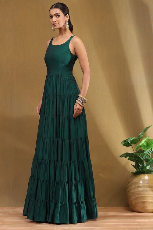 emerald green silk festive tiered anarkali dress Ayukha's anarkali dress with . It's a combination of & with long fitted chudi sleeves. The yoke is enhanced with silver