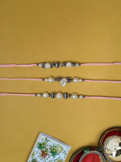 Dhiyona Set Of 3 White Pearls Thread Rakhi With Roli Chawal Chandan Mishri