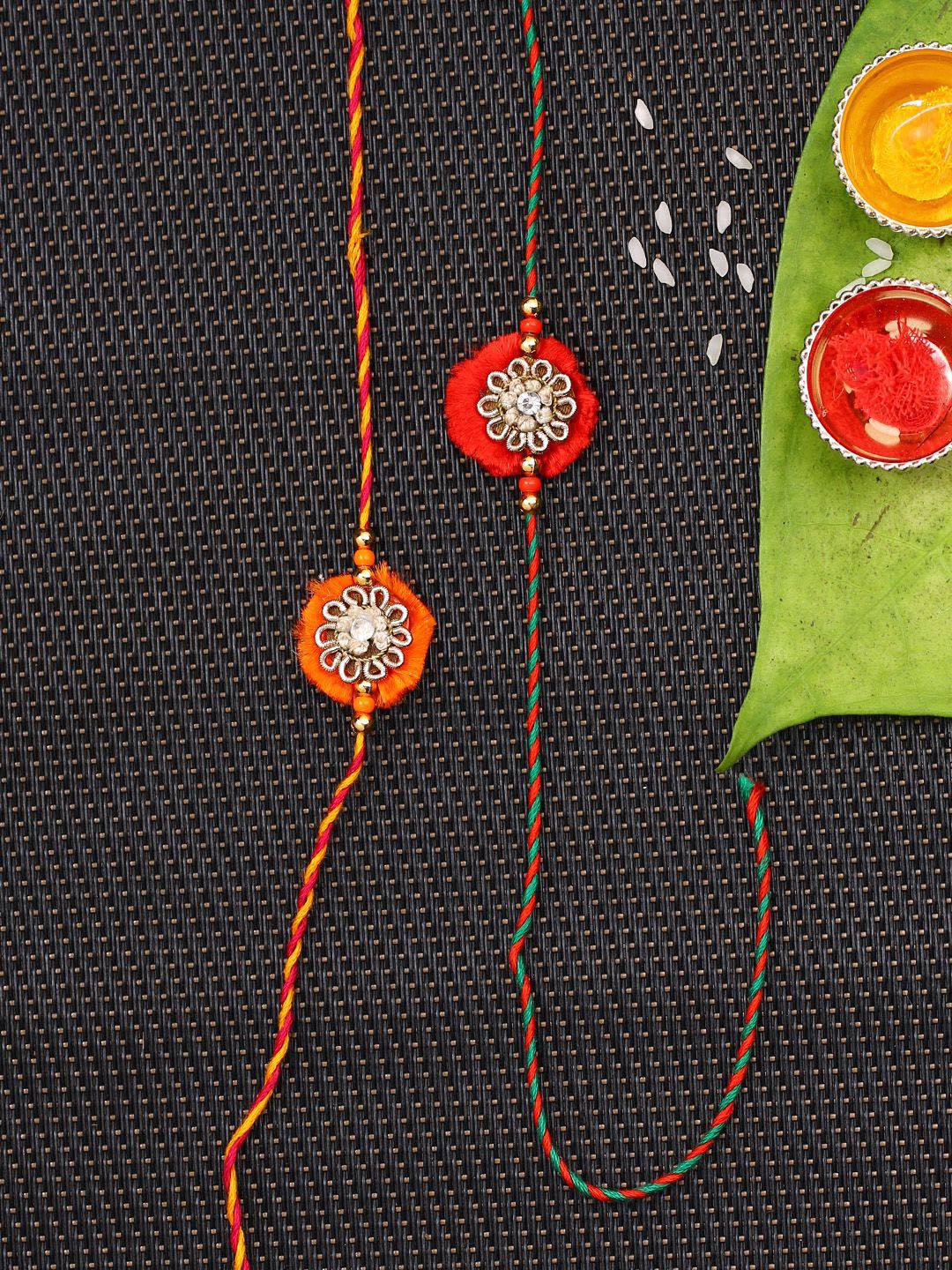 Dhiyona Set Of 2 Red Flower Design Stone Studded Rakhis Comes With Roli Rice & Greeting Card
