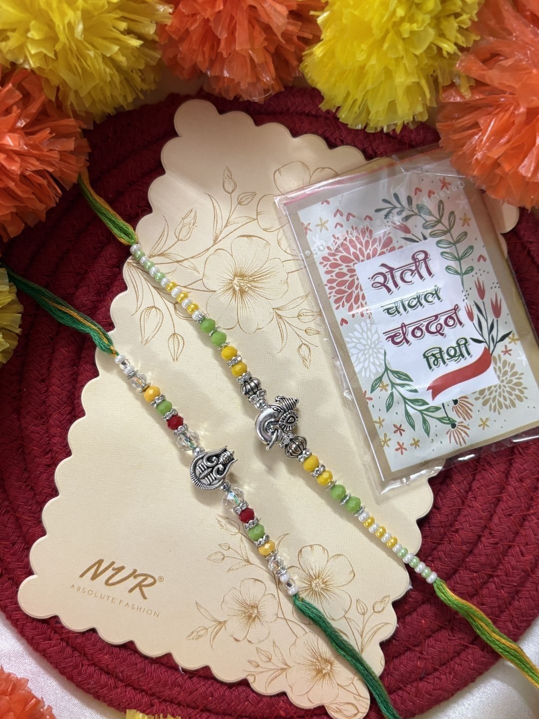 Dhiyona Set Of 2 Multicolor Religious Thread Rakhi With Roli Chawal Chandan Mishri