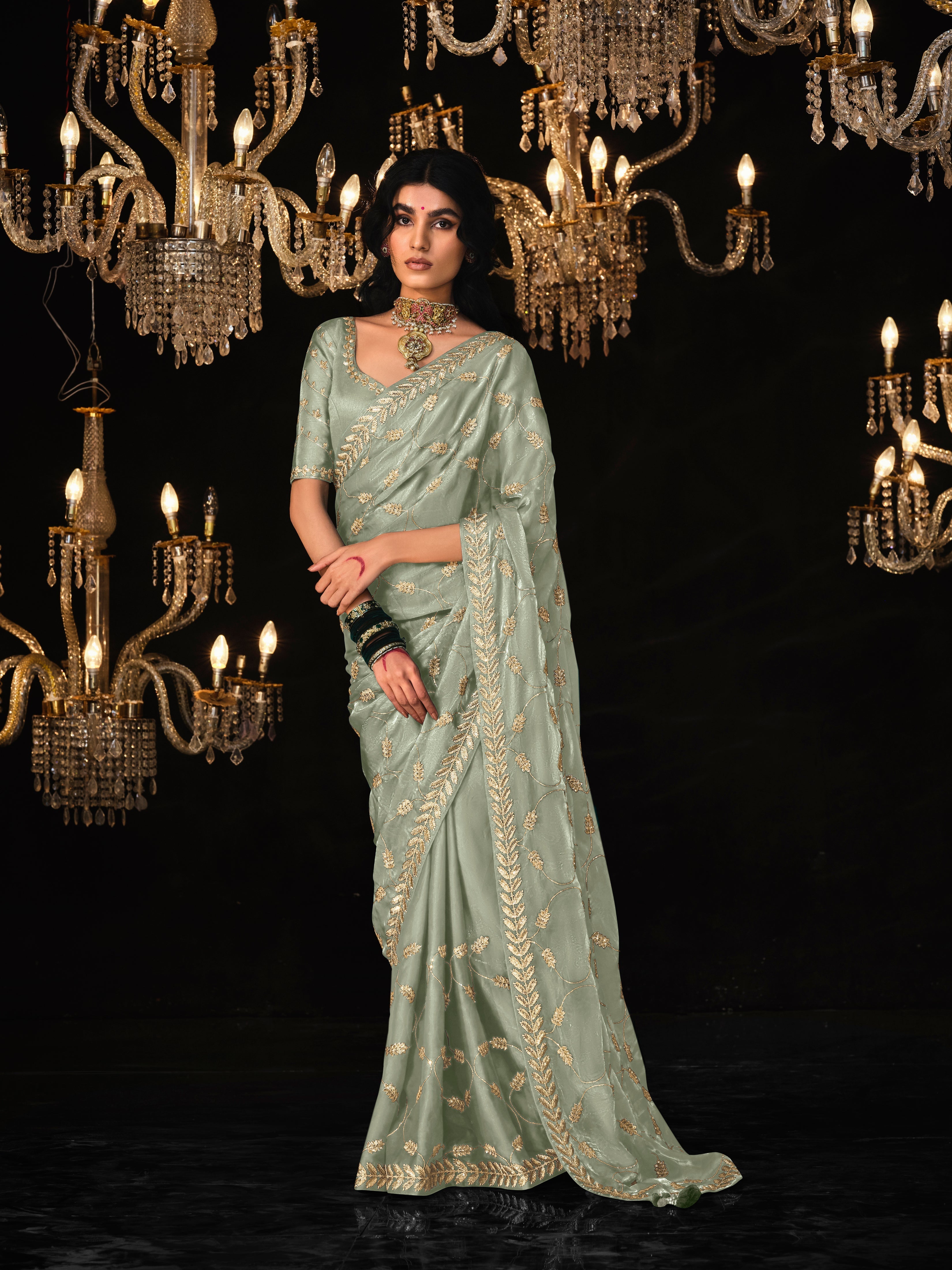 Dhiyona KM Women Olive Green Saree With Elegant Silver Embroidery