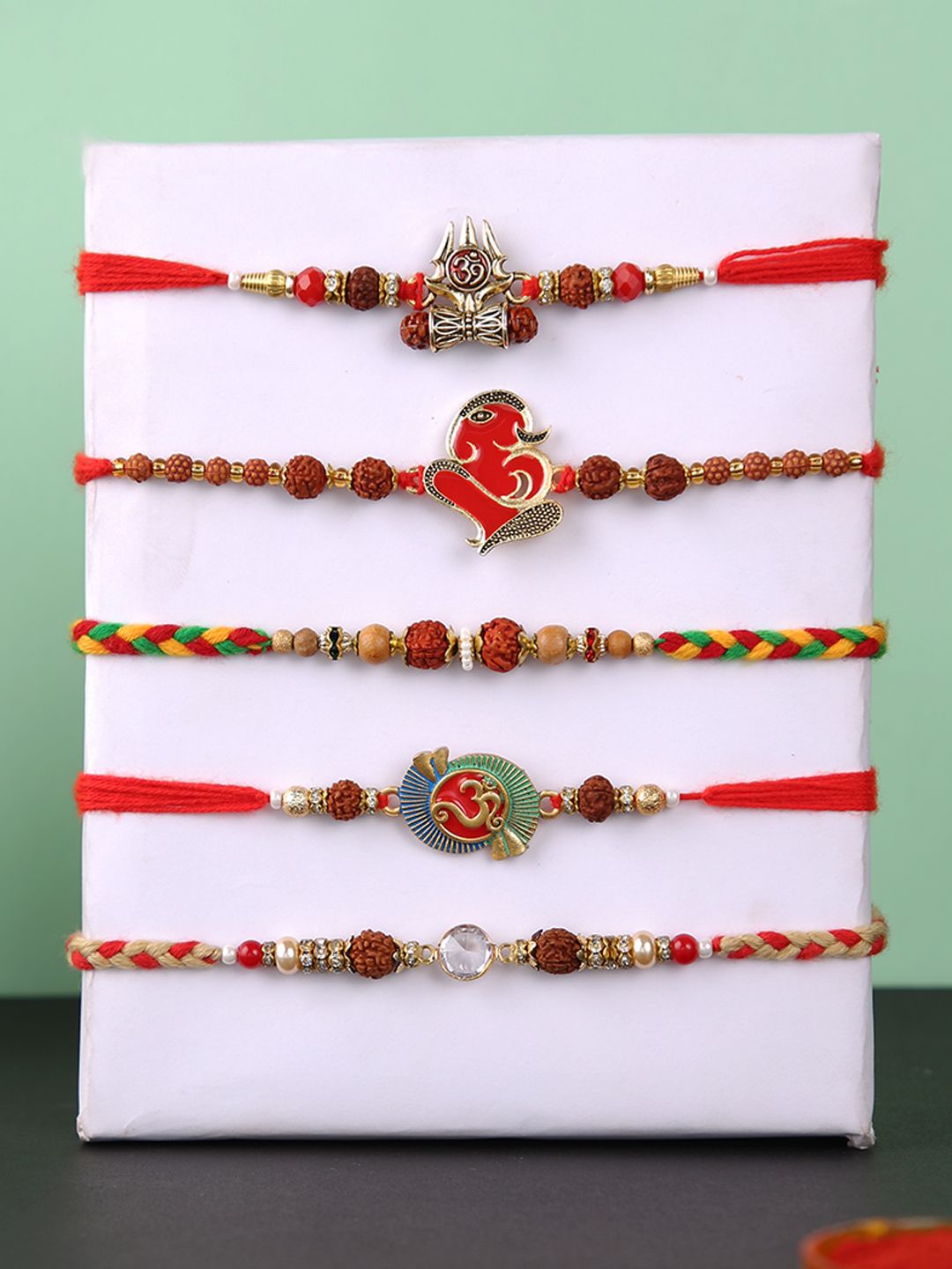 Dhiyona Set Of 5 Rudraksh & Swastik Beaded Thread Rakhi With Roli Chawal & Greetings Card