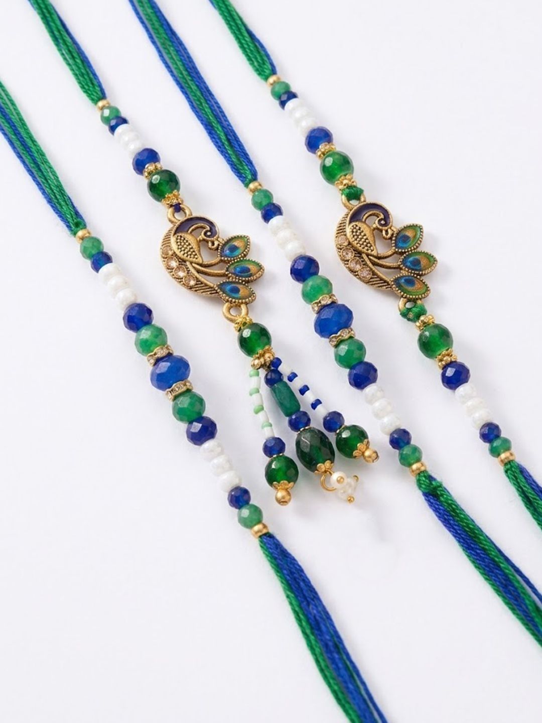 Dhiyona Set Of 4 Green Peacock Design Artificial Beads Thread Rakhi With Roli Chawal