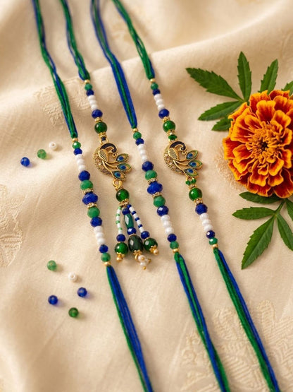 Dhiyona Set Of 4 Green Peacock Design Artificial Beads Thread Rakhi With Roli Chawal