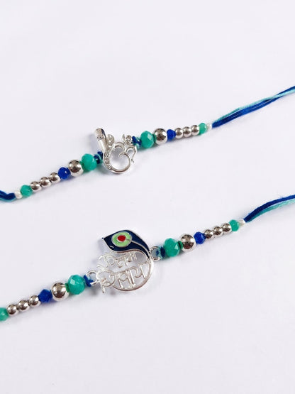 Dhiyona Set Of 2 Silver Toned Beaded Religious Thread Rakhi With Roli Chawal Chandan Mishri