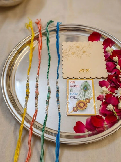 Dhiyona Set Of 4 Multicolor Artificial Beads Thread Rakhi With Roli Chawal Chandan Mishri