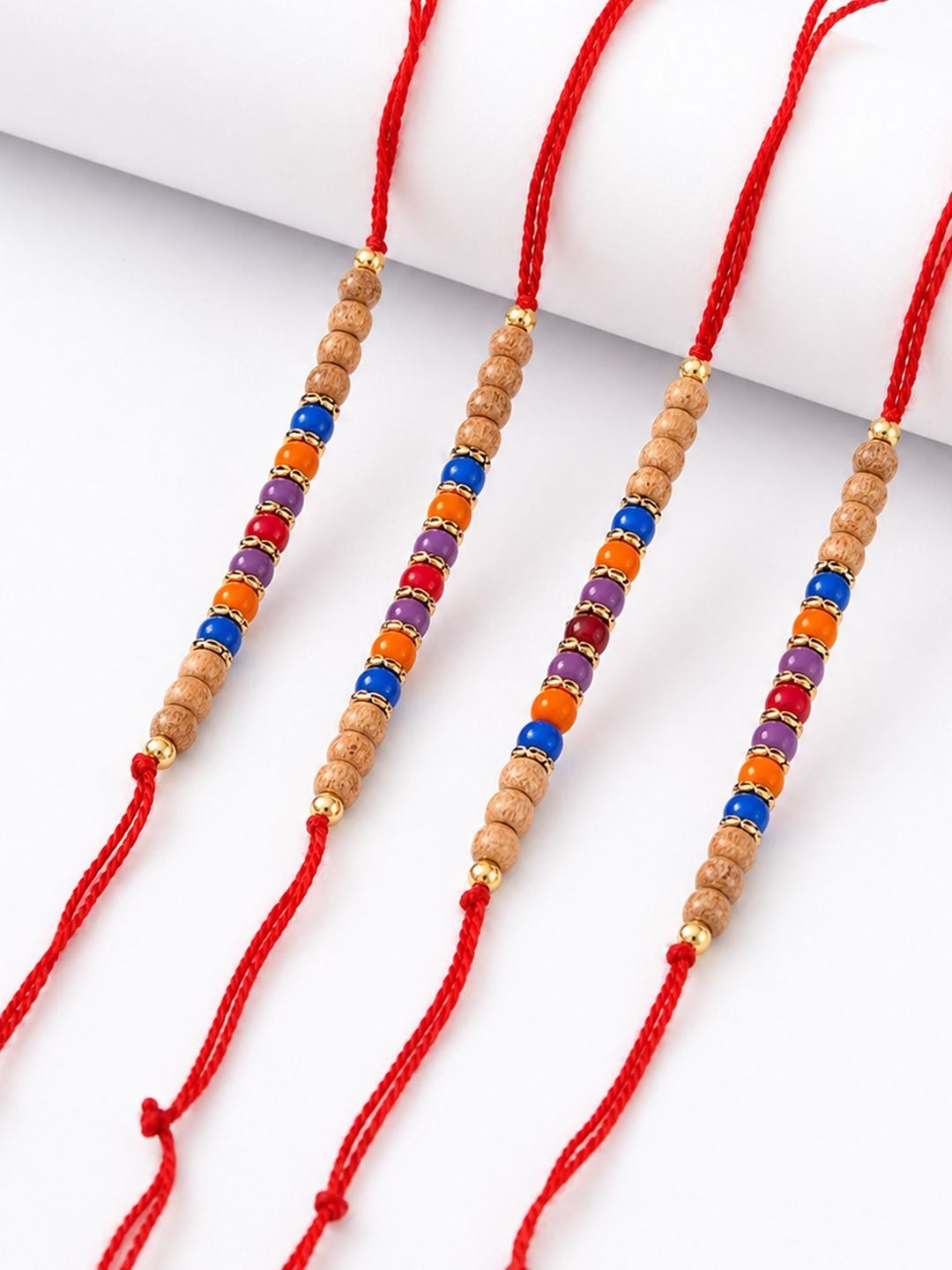 Dhiyona Set Of 4 Multicolor Circular Beads Studded Thread Rakhi With Roli Chawal Chandan