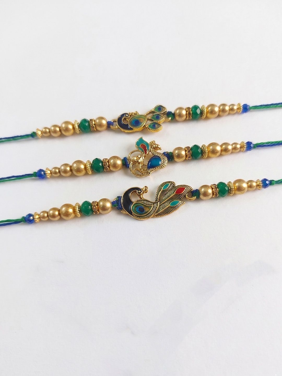 Dhiyona Set Of 3 Peacock Design Multicolor Artificial Beads Thread Rakhi With Roli Chawal