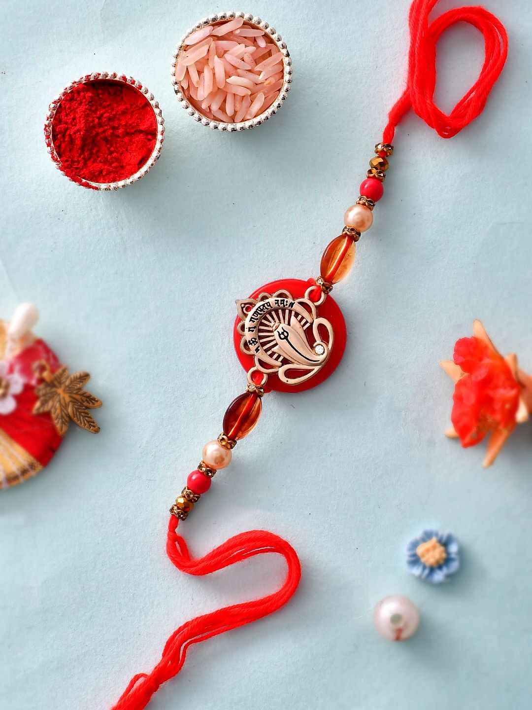 Dhiyona Red Resin-Based Ganesha Rakhi With Roli Chawal & Greeting Card