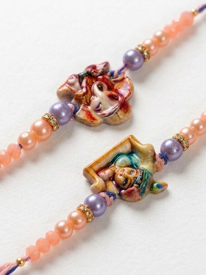 Dhiyona Set Of 2 Krishna Ji & Ganesh Ji Beaded Religious Thread Rakhi With Roli Chawal
