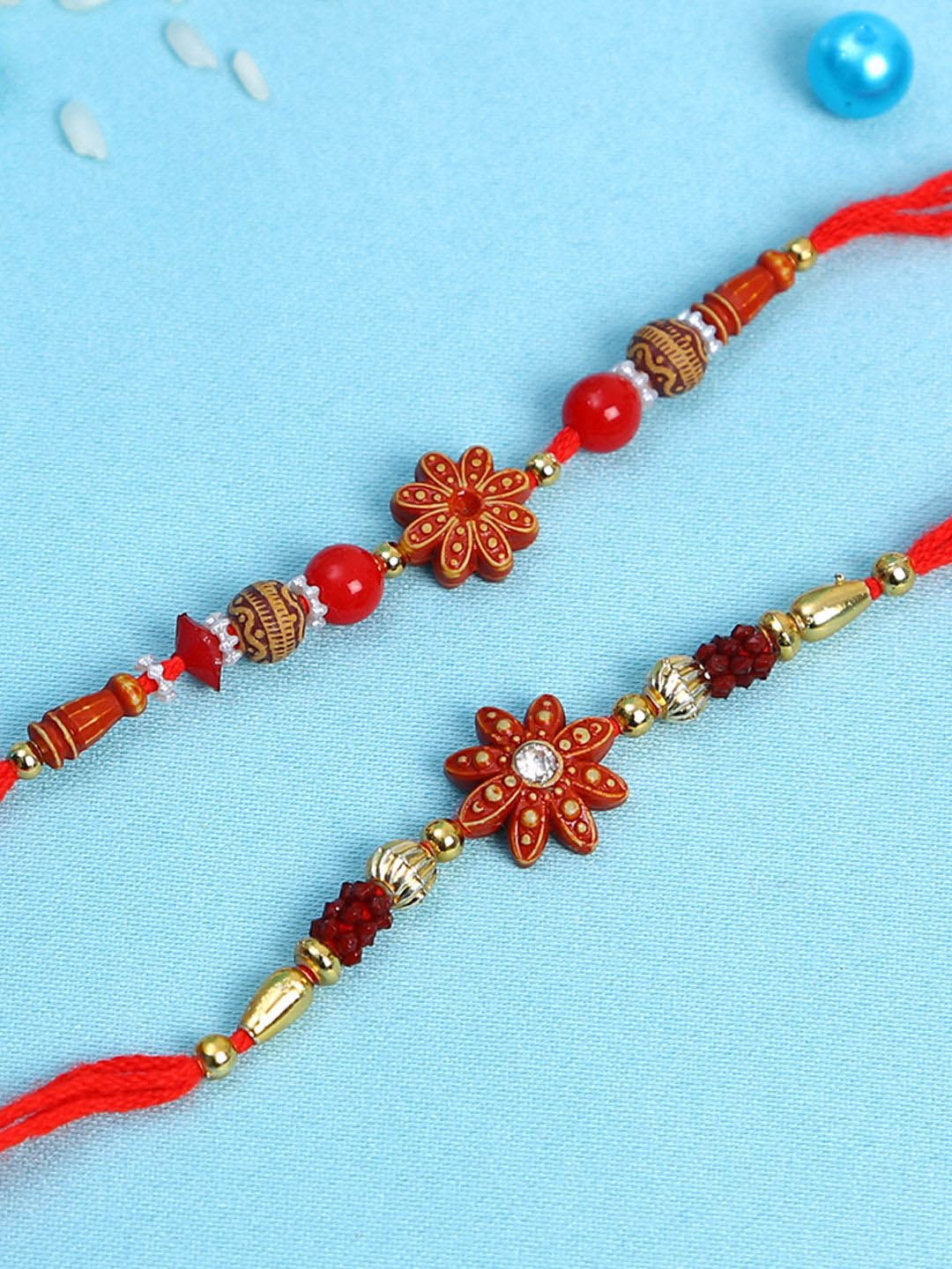 Dhiyona Set Of 2 Red Flower Rakhis Comes With Roli Rice & Greeting Card