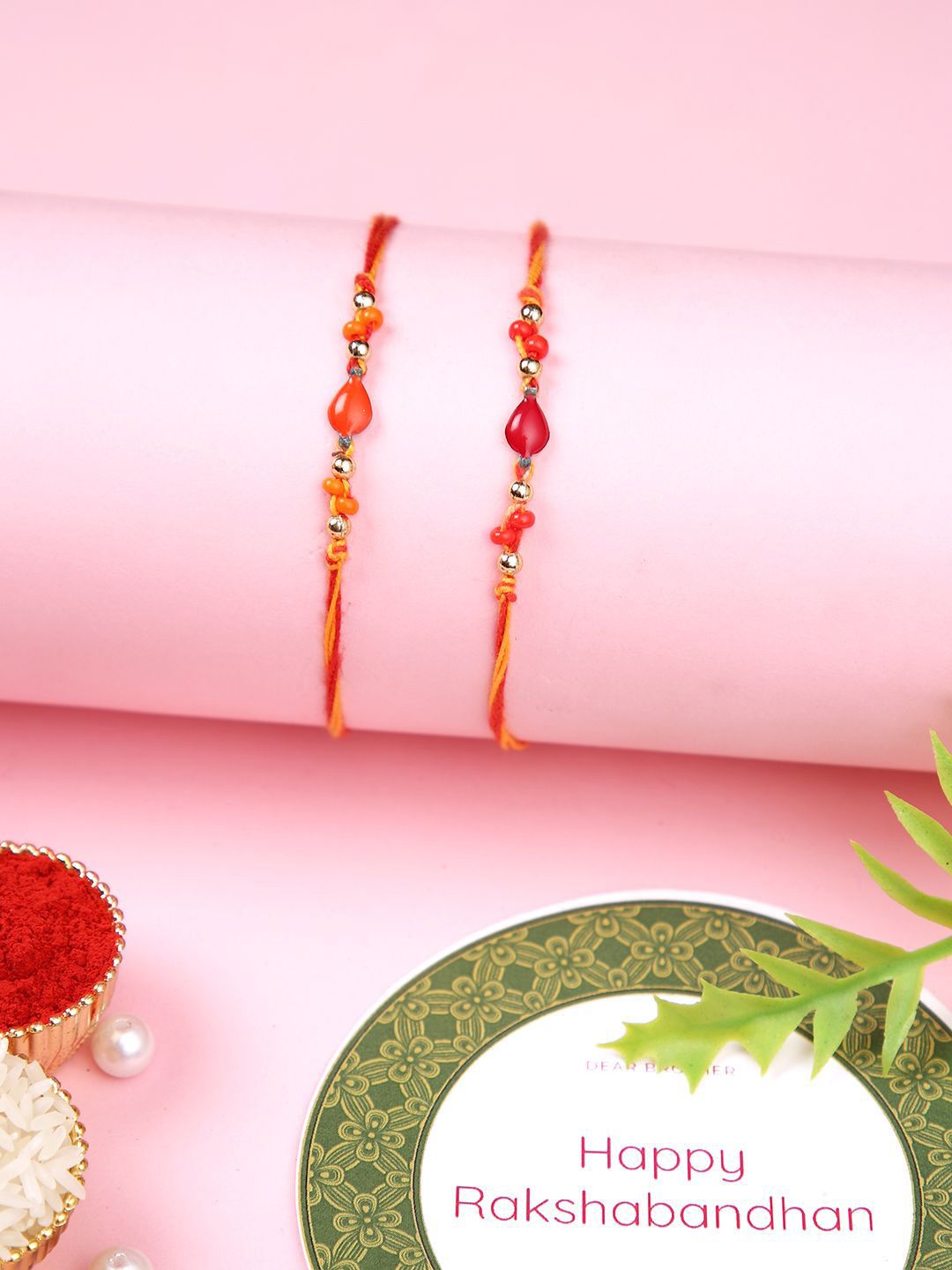 Dhiyona Orange Set Of 2 Beaded Thread Rakhis With Roli Chawal & Greeting Card