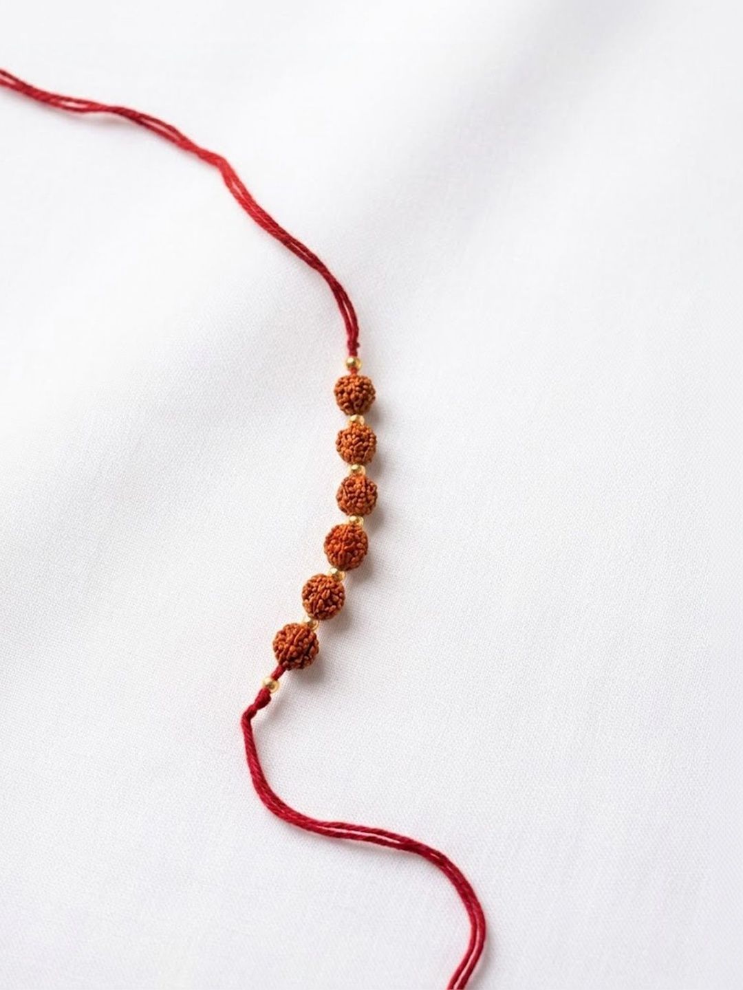 Dhiyona Religious Rudraksh Thread Rakhi With Roli Chawal Chandan Mishri