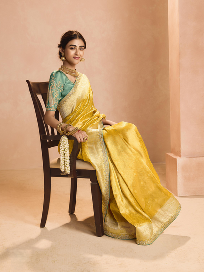 Dhiyona KM Women Yellow Kanjivaram Silk Saree With Sea Green Embroidered Blouse